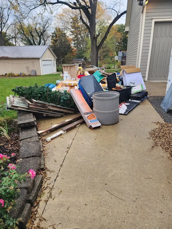 Dumpster being loaded with debris for 3 Yard Dumpster Rental in Mount Pleasant